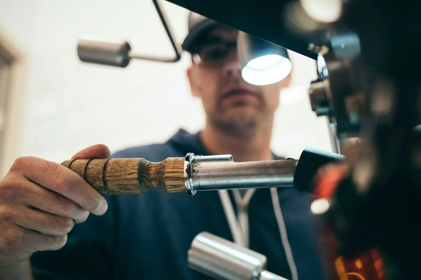 A plumber soldering copper pipe with a torch