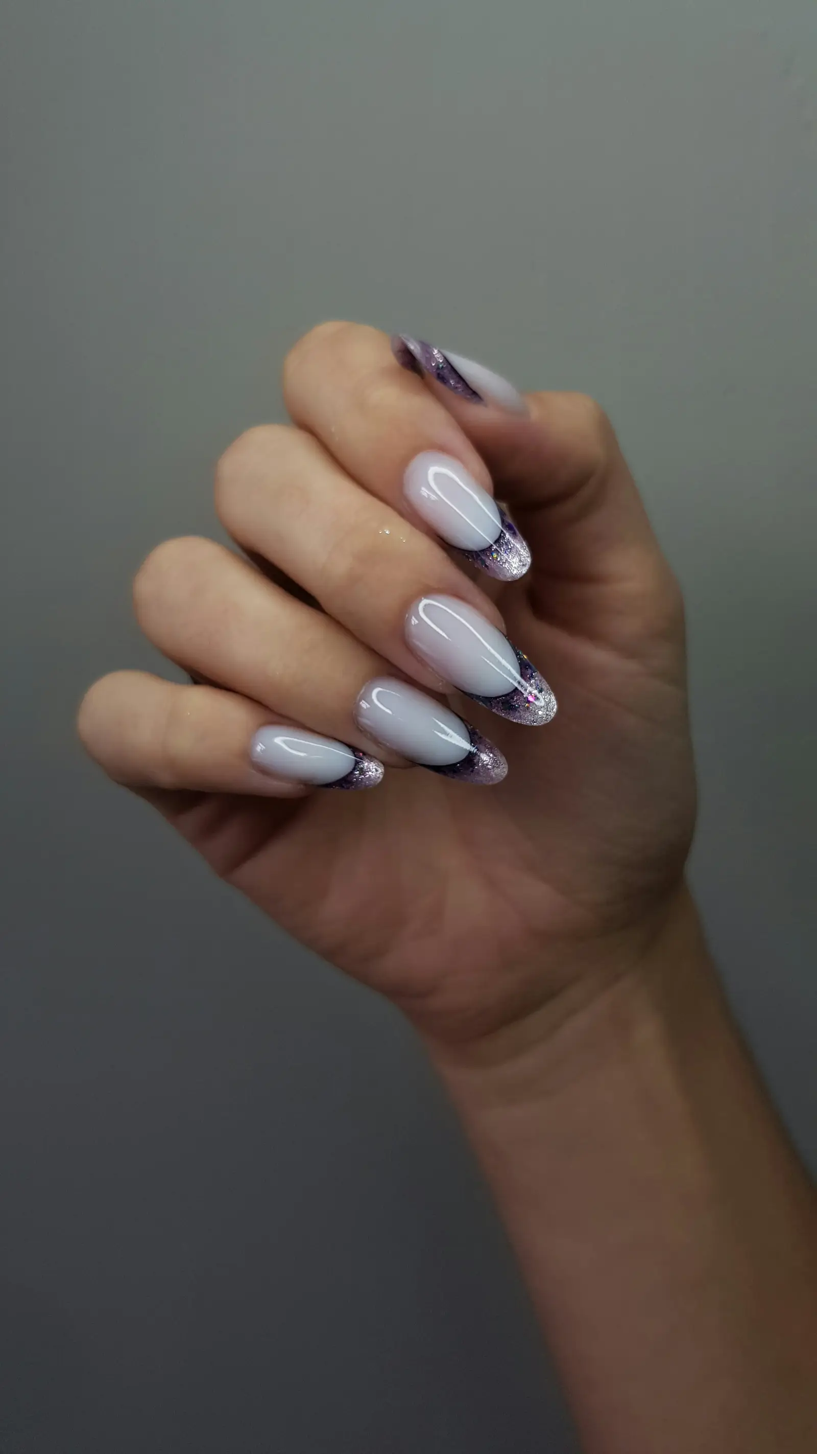 Long white almond nails with purple marbled tips
